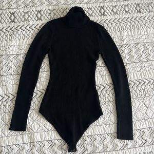 Black sinned turtleneck.